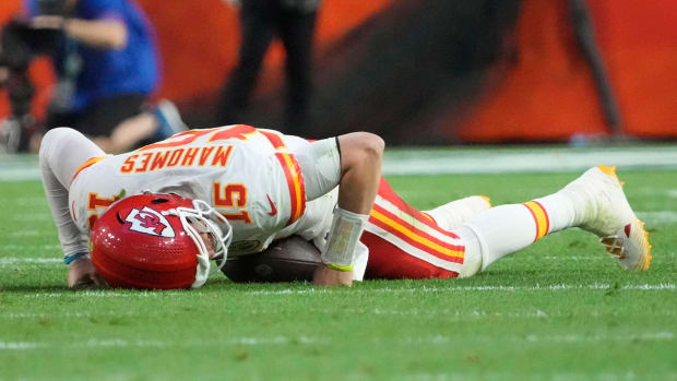 Chiefs quarterback Patrick Mahomes (15) is slow to get up after being tackled by Philadelphia Eagles linebacker T.J. Edwards (not pictured) during the second quarter in Super Bowl LVII at State Farm Stadium.